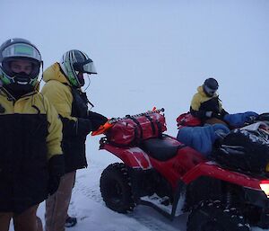 Expeditioners taking a quick break on quad training, in hazy and overcast conditions.