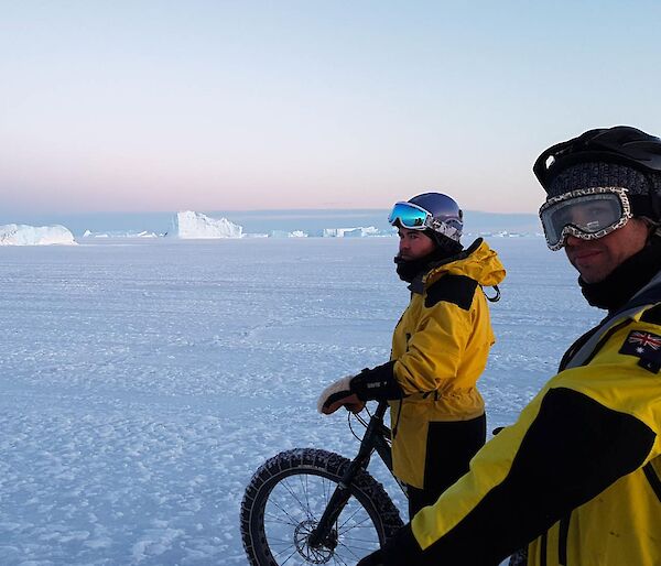 Chris and Derryn soak in the sun and enjoy the views of ice burgs of in the distance.