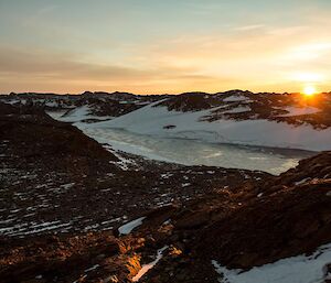 Looking at a view over frozen Lake Nicholson as the sunrises