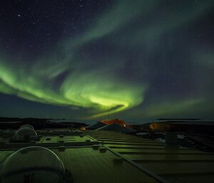 Looking at station over the atmospheric sciences building with an aurora in the sky