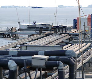 Looking across the services lines that run between the buildings with icebergs in the background.