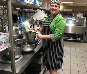 Dr Kate dressed in her cooking apron making pesto on her day as slushy.