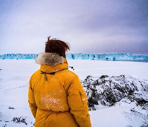 Expeditioner enjoying a quiet moment while taking in a fantastic view of the Sørsdal glacier.