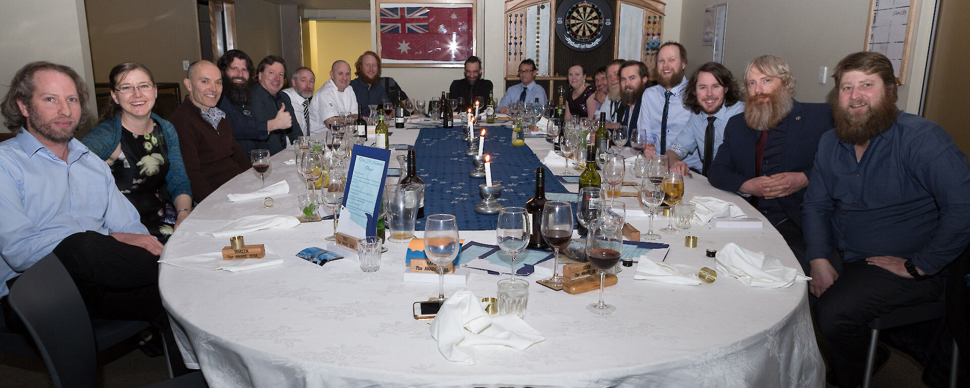 All 19 expeditioners sitting at the mid winters dinner table.