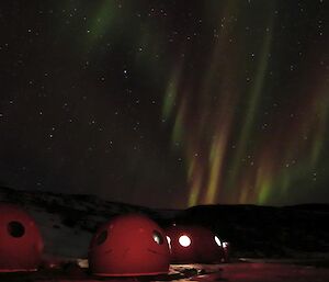 Aurora Australis lights up the starry night sky with colours over the Marine Plain camp.