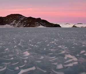 Bubbly multiyear ice eroded by the winds framed by the drama of a midwinter sky at Breid Basin.