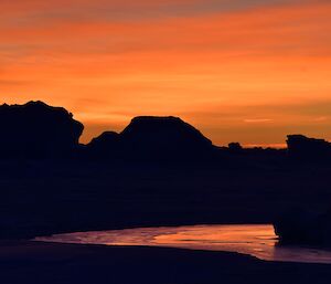 A winter sunrise among the frozen bergs near Plough Island.
