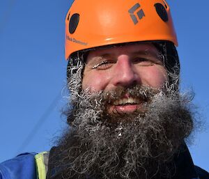 Expeditioner back on the ground after the repair with his beard iced up from breathing