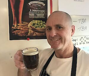 Rodney having a glass of the finished product, a nice dark ale.