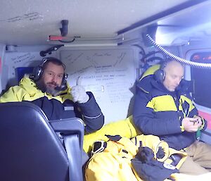 Iain on the left and Simon riding in the back seats of the Hagglund as they make their way to the Rauer Islands.