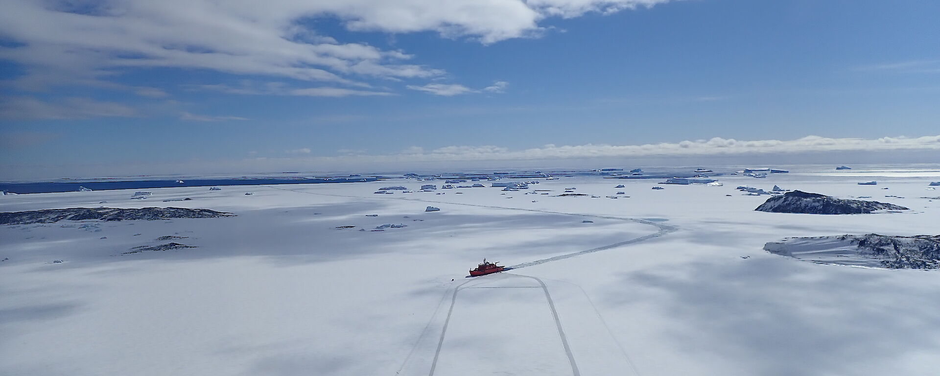 Aerial view of Aurora Australis in fast ice off Davis station