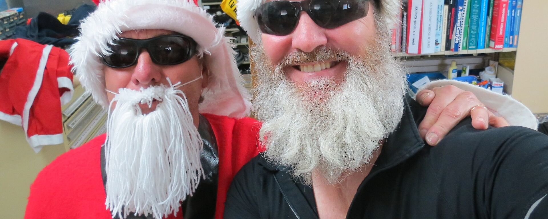 Two Santas: Santa Joe (left) and Santa Paul (right) — expeditioners dressed as fake Santas