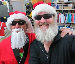 Two Santas: Santa Joe (left) and Santa Paul (right) — expeditioners dressed as fake Santas