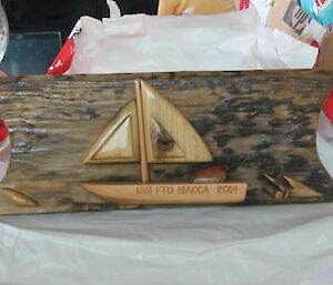 A small yacht carved into a piece of wood by Graeme