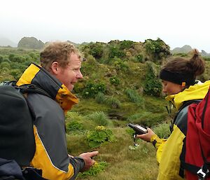 Wildlife ranger Mike and researcher Kate checking GPS co-ordinates