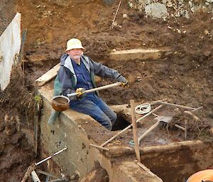 Ivor cleaning out the dam silt trap