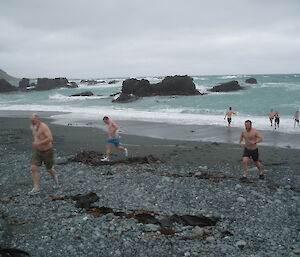 Swimmers run across the isthmus