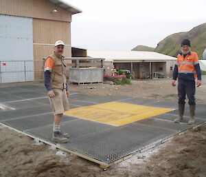 Pat and Pete with recently completed helipad outside the machinery shed