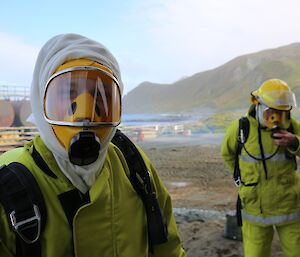 Keon dons his fire gear including a mask that covers his face