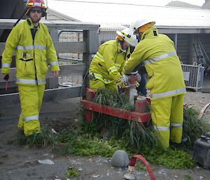 Keon and first responders Benny and Paul connect the fire hose to the fire water supply