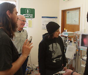 Sean, Malcolm, Evelyn and Paul training on the anaesthetics monitoring machine