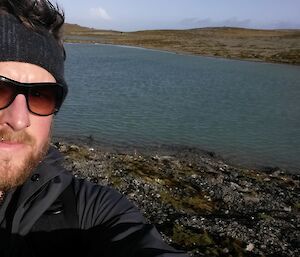Keon en route to Hurd Point takes a selfie in front of a small lake