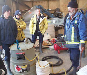 Pete (right) demonstrates use of the Dragin pump