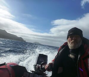 Boating officer/expedition mechanic Pete skippering a zodiac