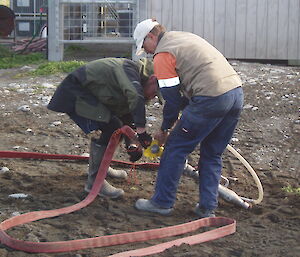 Hose crew Mike and Pat set up hoses
