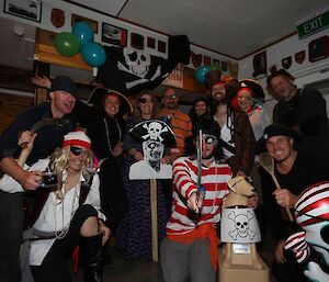 Group photo of expeditioners in pirate costumes.