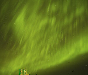 Amphibious vehicle in foreground with aurora in background