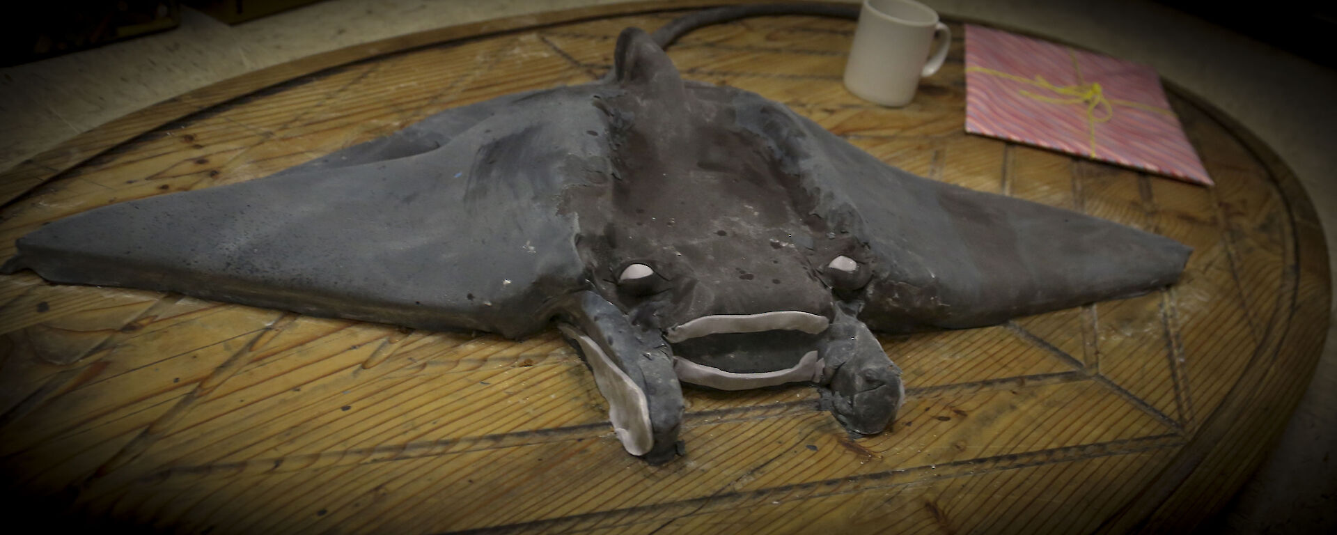 Large cake with a fondant manta ray on top