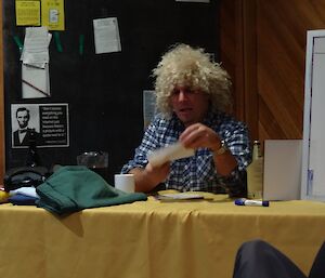 Quizmaster Justin in crazy, curly afro wig