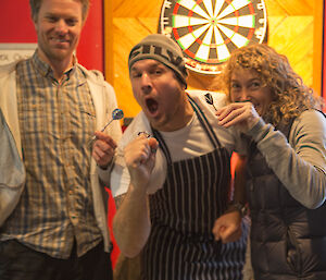 Justin, Mark and Jac in front of dartboard