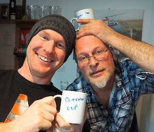 Rich and Nick with mugs labelled ‘Duncan Cup'