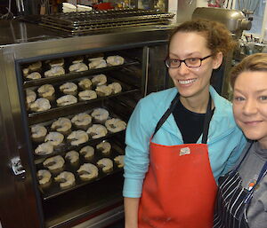 Louise and Marion in front of oven filled with unbaked croissants