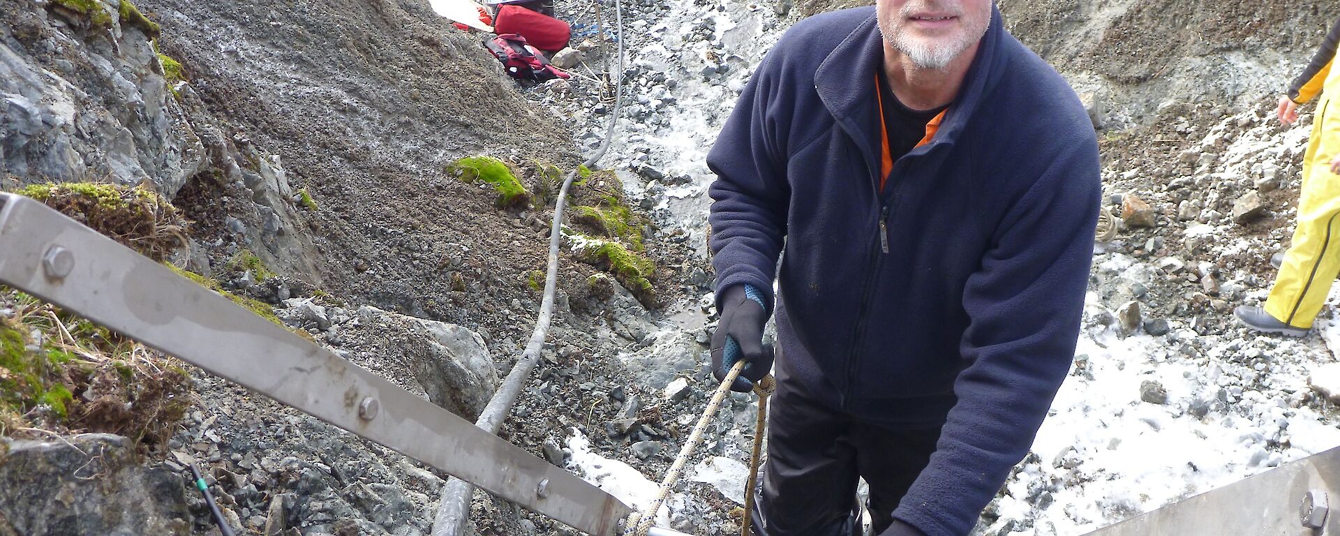 An expeditioner working atop a ladder in Gadgets Gully.