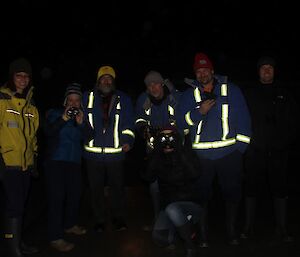 Group shot of participants in dark