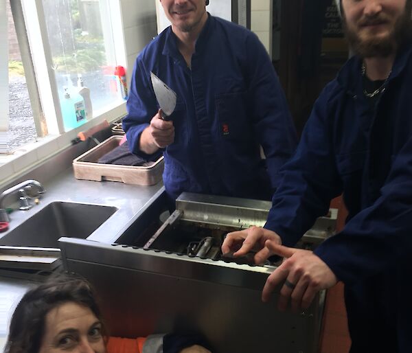Justin Ben and Jacque cleaning an oven