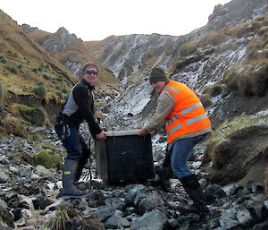 Rich and Justin standing in Gadgets Gully with large plastic tub