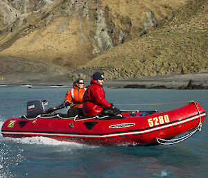 Jacque and Ben in red IRB boat