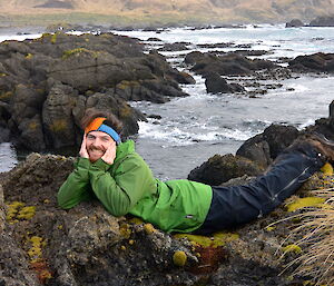 Dan laying in a rock pool at Bauer Bay