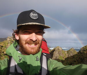 Dan at the Labyrinth in front of a rainbow