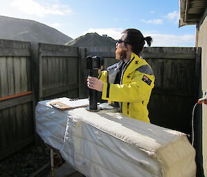 Weather observer Dan taking a total ozone reading on a rare sunny day