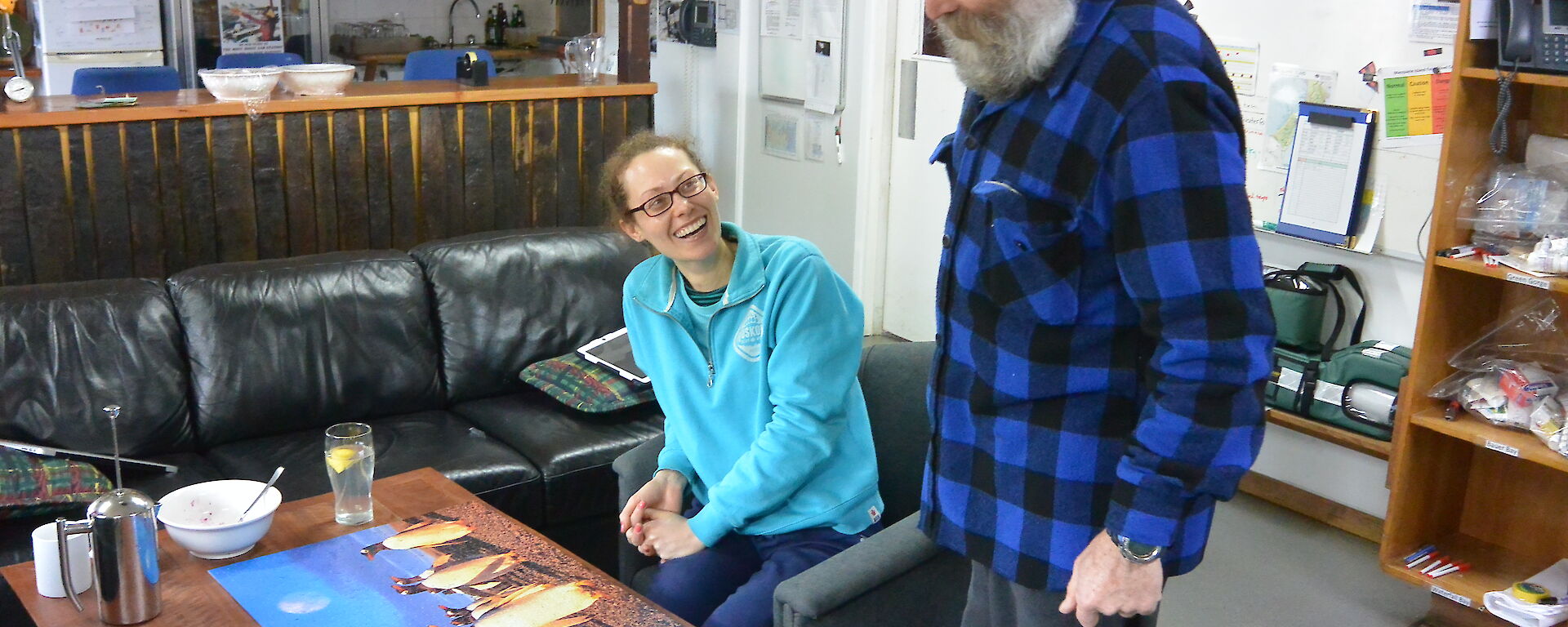 Louise and Lionel in the mess looking at a penguin puzzle