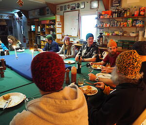 Expeditioners in mess wearing colourful beanies