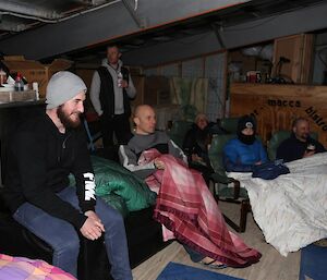 Expeditioners sitting with blankets