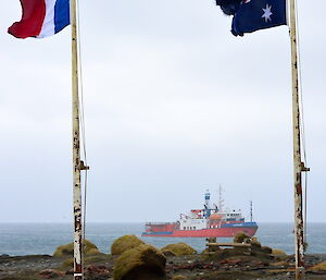 L'Astrolabe in Buckles Bay with flags in foreground