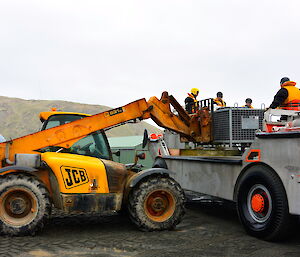 Ben using the JCB to unload the LARC