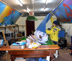 Marion tipping mailbag onto the pool table